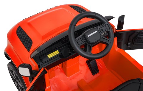 Auto Land Rover Defender pomarańczowe na akumulator dla dzieci + pilot R/C