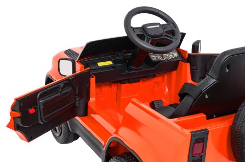 Auto Land Rover Defender pomarańczowe na akumulator dla dzieci + pilot R/C