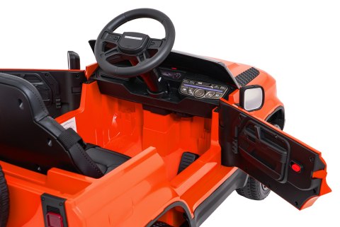 Auto Land Rover Defender pomarańczowe na akumulator dla dzieci + pilot R/C
